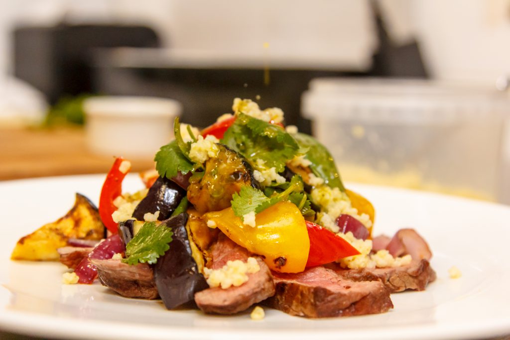 Beef salad (roast beef), roasted sweet peppers, quinoa, eggplant BBQ, and grilled onions.